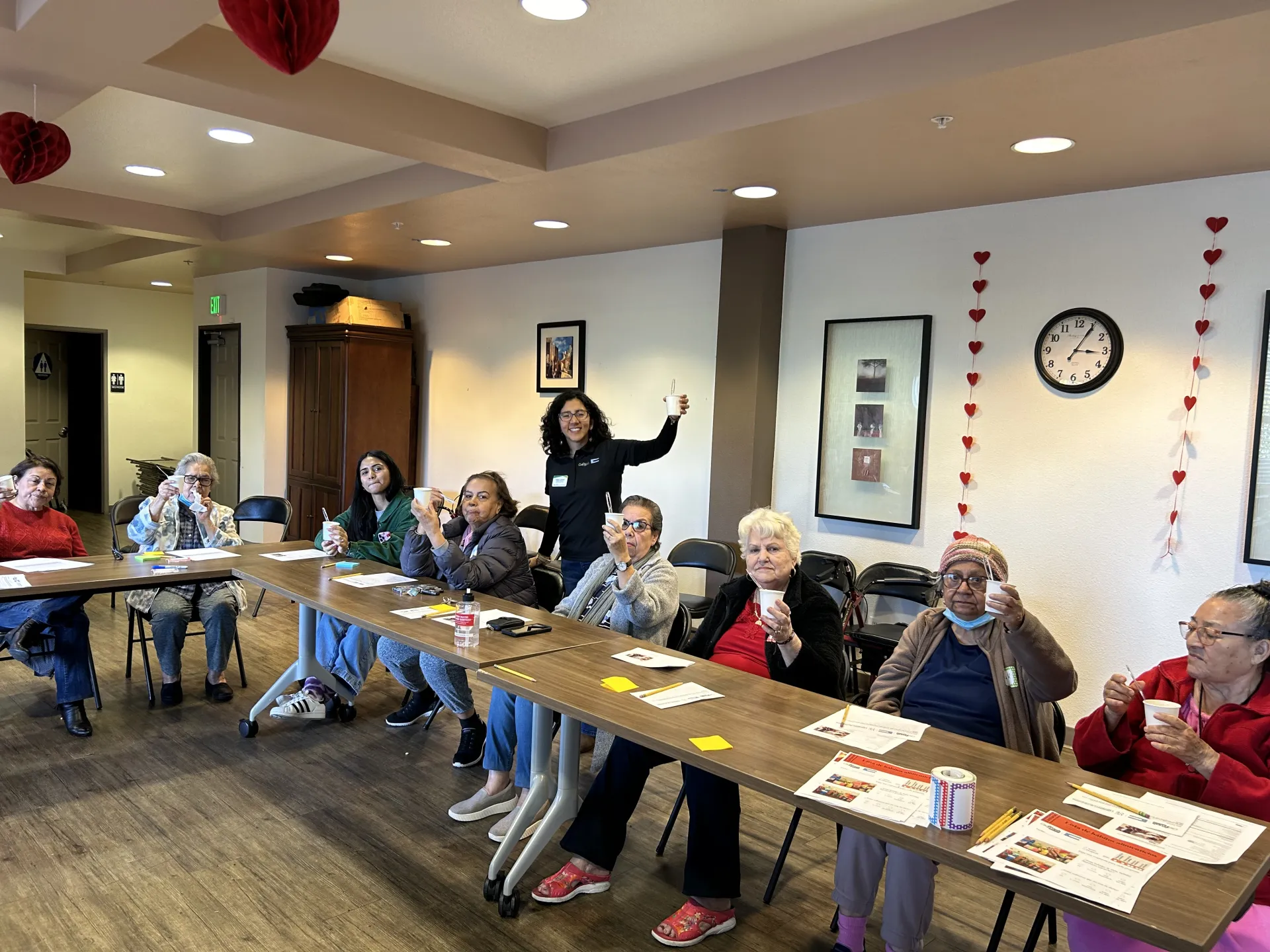 Ingrid Alarcón poses with community members at Oaks on Florence senior center during a nutrition class