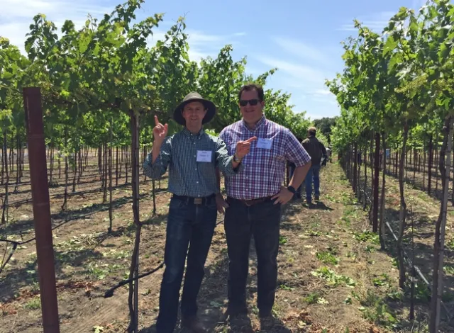 The VINE partner John Selep, left, joined Gabe Youtsey at a recent Grape Day at Oakville.